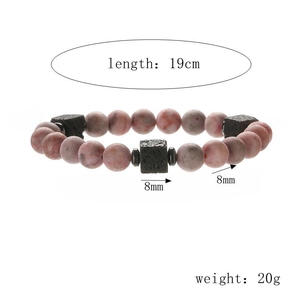 Detail view of 8mm marble beads and black lava stone bracelet with 19cm length and 20g weight