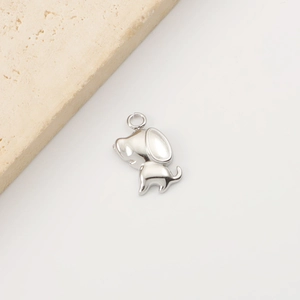 Detailed view of a silver puppy animal pendant made of smooth stainless steel for DIY jewelry