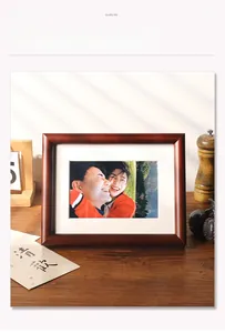 Detail of dark walnut solid wood photo frame with white mat for desktop display