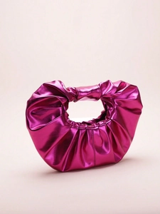 Detail of metallic rose pink pleated cloud bag featuring glossy faux leather texture