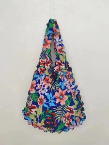 Detailed view of vibrant floral print textured stretch bubble tote with pleated fabric design