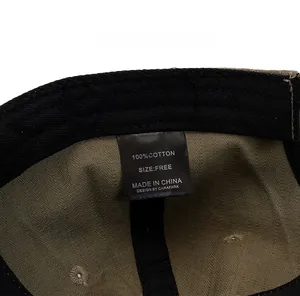 Detailed close-up of the 100% cotton care label and inner fabric of the vintage baseball cap