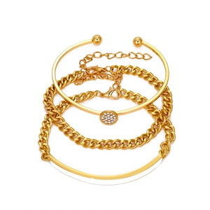 Punk style gold geometric bracelet set with zircon circle charm on white background