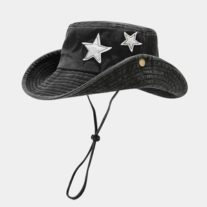 Detail showing distressed grey bucket hat with star patches and adjustable windproof cord