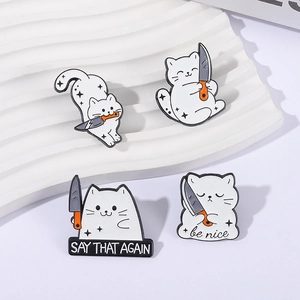 Detail view of four funny white cat enamel pins with knives on a textured background