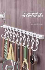 Detail of sliding kitchen rail with 2.5cm wide opening hooks for spatulas and utensils