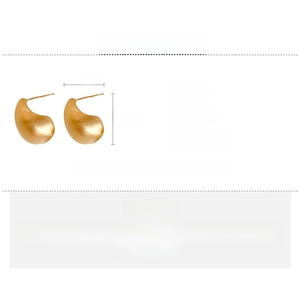 Detailed size and weight specs for golden teardrop earrings with a brushed metal finish
