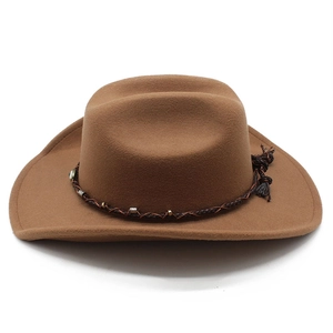 Close-up of wool felt western hat with braided band, metal beads, and tassel detail