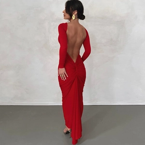 Detail of the backless design and ruching on the back of this long red evening dress