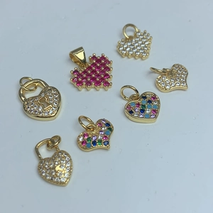 Golden heart and lock charms set with colorful zircon crystals for jewelry making