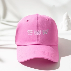 Pink cotton baseball cap with silver butterfly embroidery on a clean nature-inspired set
