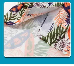 Detail view of the secure hook and loop fastener on tropical leaf print dog shirt