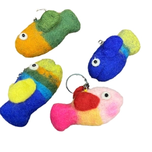 Handmade wool felt octopus keychains in four colorful cartoon designs with metal rings