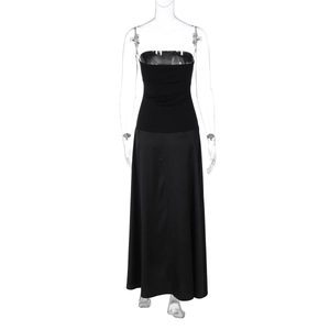Detailed view of the strapless neckline and glossy satin fabric of the black maxi dress
