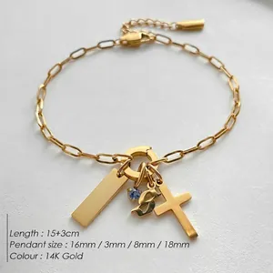 Elegant 14K gold plated stainless steel bracelet featuring cross and multi-pendant charms