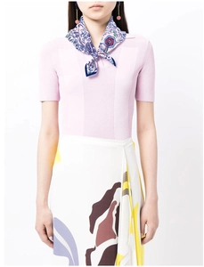 Detail showing hand-painted floral silk scarf styled with pink knit top on a model