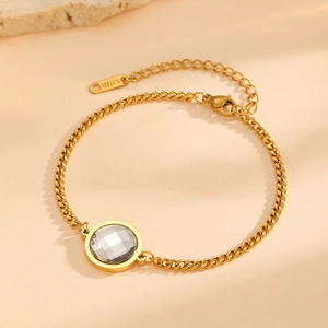 Elegant 18K gold-plated stainless steel chain bracelet featuring a round cut crystal stone