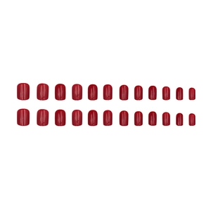 Short glossy red press-on nails in various sizes displayed on a clean white background