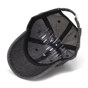 Detail view of denim baseball cap interior with sweatband and adjustable buckle