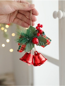 Christmas bell ornament with red metal bells, plaid bow, pine needles and red berries