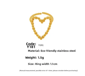 Detail of a golden stainless steel beaded heart ring with size and weight specs