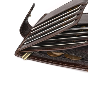 Macro detail of genuine leather tri-fold wallet showing card slots and zipper pocket