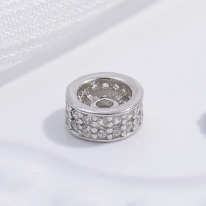 Polished S925 sterling silver spacer bead with double-row cubic zirconia inlay