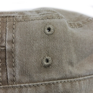 Close-up of khaki twill cotton cap showing durable stitching and ventilation eyelets