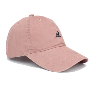 Detailed embroidery of a navy blue dog logo on a dusty pink twill cotton baseball cap
