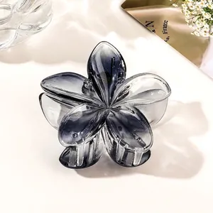 Detail of the gray gradient flower hair claw clip with transparent resin petals