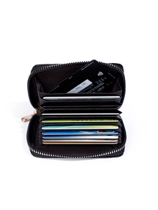 Close-up of black lychee grain leather card holder with multi-slot accordion interior