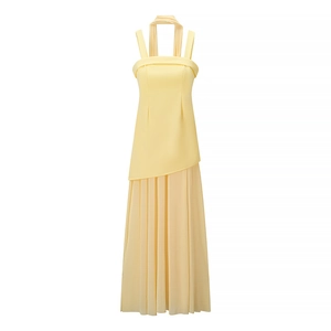 Elegant yellow halter neck maxi dress with pleated skirt and asymmetrical hemline design