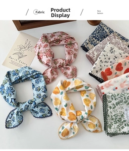 Detailed view of floral cotton linen scarves featuring delicate lace borders and patterns