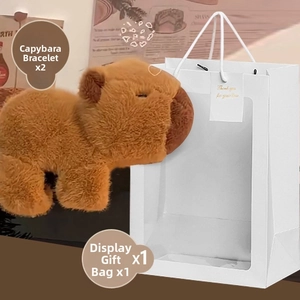 Plush capybara snap bracelets in white window gift bag with a thank you tag