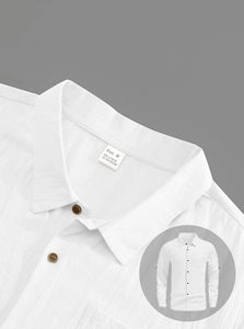 Detailed close-up of white linen shirt neckline texture and material labels