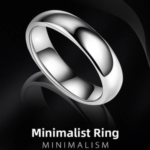 Close-up of a 4mm polished stainless steel minimalist ring reflecting on a black surface