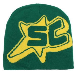 Detail of dark green knit beanie featuring a yellow star and jacquard letter pattern