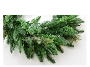 Close-up of 60cm pine wreath with warm white LED lights on a clean white background