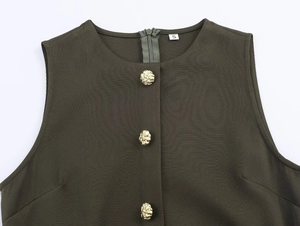 Detail of olive green midi dress with gold buttons and a high-quality woven fabric texture