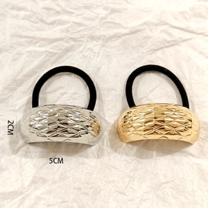 Detail of 5cm hollow oval hair rings with diamond pattern in gold and silver finish