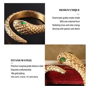Detail of 18k gold plated snake ring featuring scale texture and green stone eyes