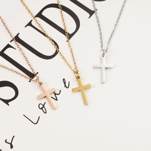 Minimalist stainless steel cross necklaces in rose gold, gold, and silver finishes