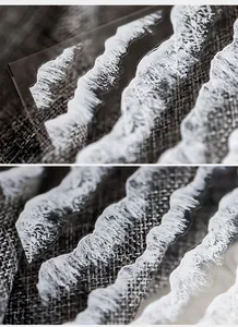 Macro detail of transparent nail stickers with white bubble texture and water wave patterns