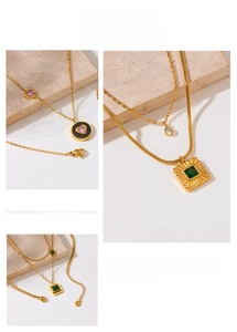 Detail of 18K gold-plated stainless steel necklaces with heart and square pendants