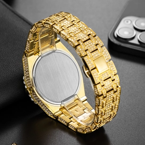 Macro detail of luxury gold watch showing micro-pave diamonds and brushed metal back