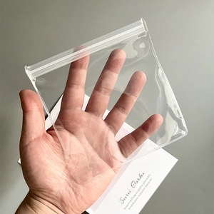 Close-up of thick transparent EVA jewelry storage bag with secure zip-lock seal