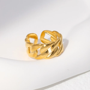 Detail of gold Cuban link chain ring with high-polished finish and open adjustable band