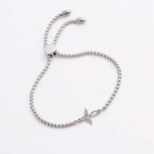 Silver steel bracelet featuring a cross and wings pendant on a square link chain