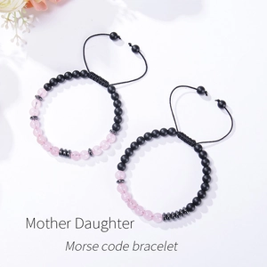 Mother Daughter Morse code bracelet set with pink crystals and black beads on white background