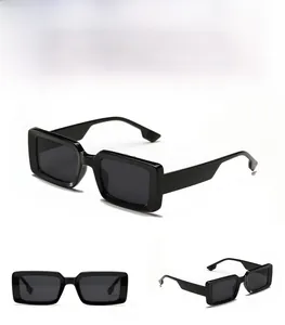 Close-up of rectangular black sunglasses with thick frames and grey lenses in three views